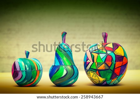 Decorative fruit - pears and apples, made of wood and painted by hand paints. modern art