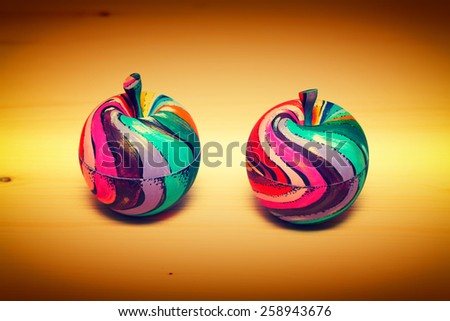 Decorative fruit apples, made of wood and painted by hand paints. Modern art, handmade.