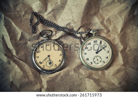 Vintage antique clock on vintage background