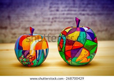 Decorative colorful apples fruits made of wood, hand-painted. Modern art, handmade.