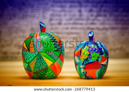 Decorative fruit apples, made of wood and painted by hand paints. Modern art.