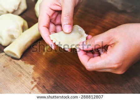 Woman hand making curry puff