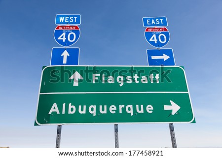 US Interstate I-40 road sign in Arizona with a sky blue background