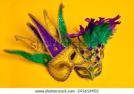 A group venetian, mardi gras mask or disguise on a yellow background
