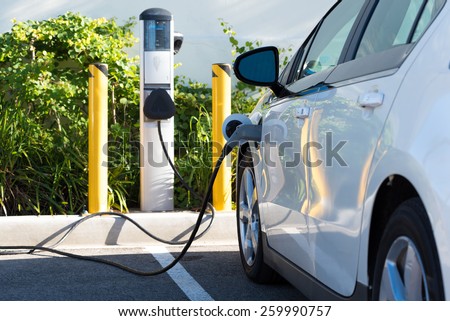 An electric car charging in California
