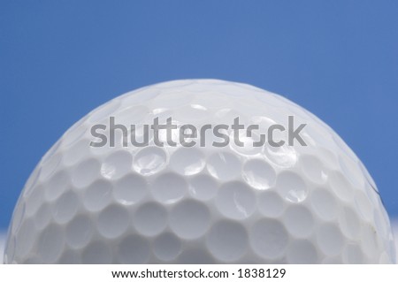 golf ball close up with blue sky