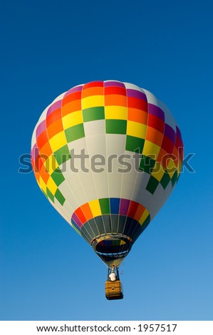Beautiful hot air balloon against dark blue sky with basket