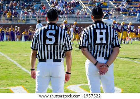 American Football played by young men with game official linesman and side-judge referee