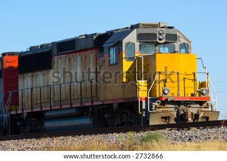 Train engine in yard on sunny day