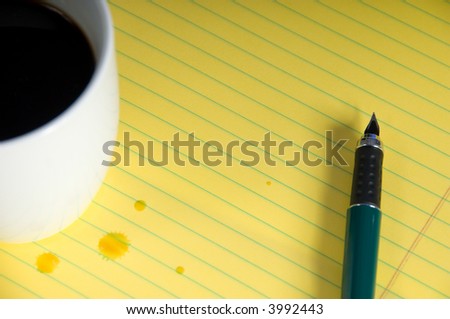Coffee on yellow legal pad with pen- insert your own text or graphic