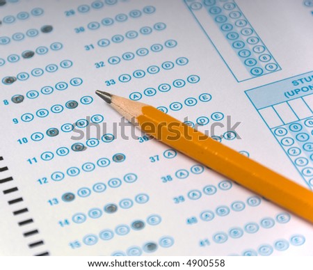 Multiple choice test and yellow pencil