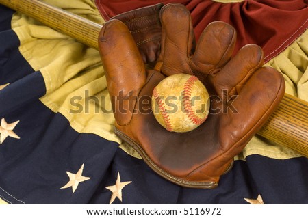 Antique baseball glove, ball and bat on vintage american flag inspired bunting