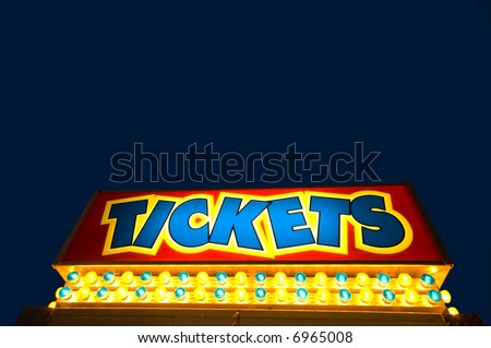 Ticket booth against dark blue dusky sky wit copy space above ticket message