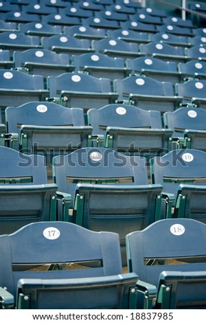 A background of green empty stadium seating