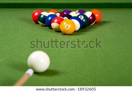 A set of pool or billiard ball on a green felt table