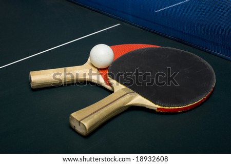 Ping-pong or table tennis equipment or supplies on a playing surface