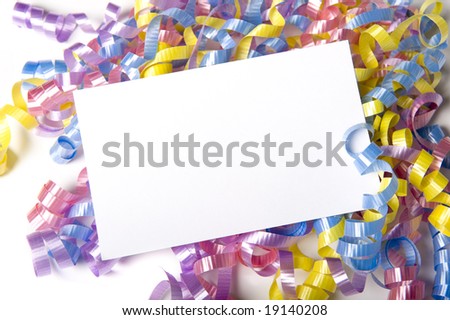 A blank white note card or note surrounded by curly ribbons or bows on white