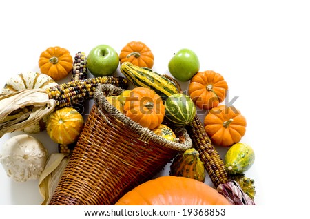 A harvest, autumn or thanksgiving cornucopia with corn, pumpkins, apples, etc