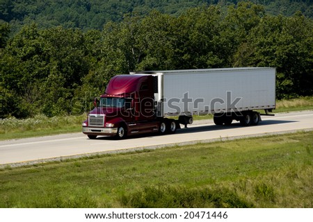 A 18-wheel truck on a highway, transportation industry