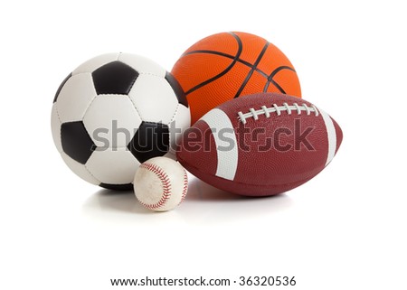 Assorted sports ball on a white background.  Includes a soccer ball, a football, a basketball and a baseball