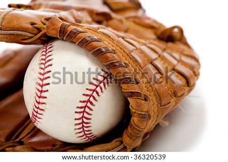 Brown leather baseball glove with a baseball on a white background