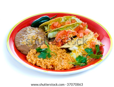 A colorful Mexican food plate with tacos, bean and rice