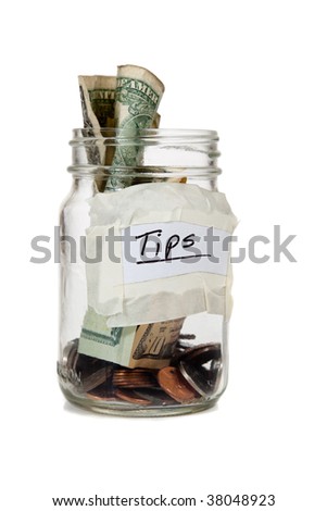 a tip jar with coins and bills
