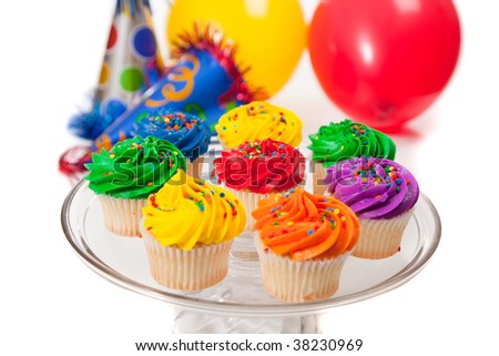 اروع تشكيلة لمحبي الكاب كيك Stock-photo-various-colored-cupcakes-party-hats-and-ballons-on-a-white-background-38230969