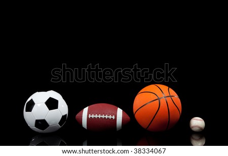 Multi sports balls on a black background