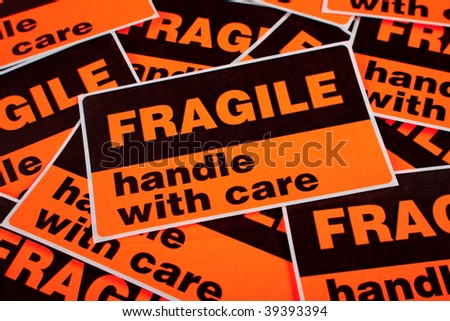 A background of orange fragile stickers
