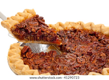 A whole pecan pie on a white background
