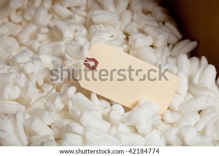 A background of packing foam with a shipping label
