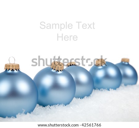 Baby blue Christmas ornaments/baubles on a white background with copy space
