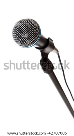 A microphone on the stand on a white background with copy space