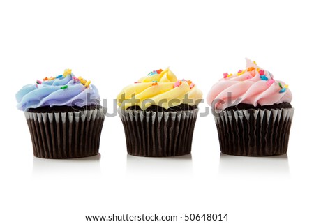 Pastel chocolate cupcakes including pink, blue and yellow on white