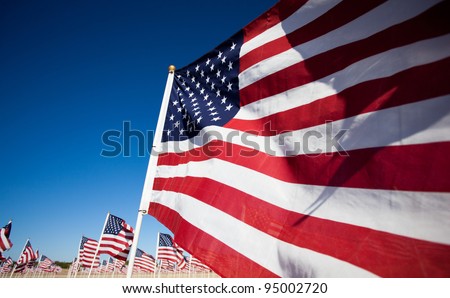 Large group of American Flags commemorating a national holiday, veterans day, independence day, 9/11, etc