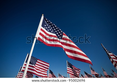Large group of American Flags commemorating a national holiday, veterans day, independence day, 9/11, etc