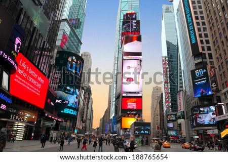 NEW YORK CITY, USA - MARCH 22, 2014: Times Square on March 22, 2014 in New York City. Times Square with lots of advertising at sunset.