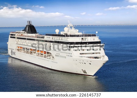 Lisbon, Portugal - October 02, 2014: Cruise Line MSC, cruise ship MSC Opera sails from port Lisbon in Portugal  on October 02, 2014. She can accommodate 2,055 passengers in 856 cabins.