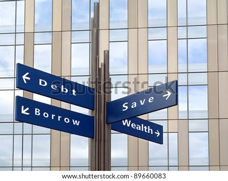 Financial decisions direction sign with office building in background