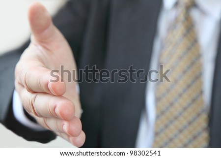 Business welcome. Closeup of businessman ready to give handshake , open gesture