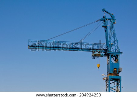 Blue crane against clear sky.