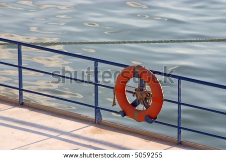 float life saver on ship fence.