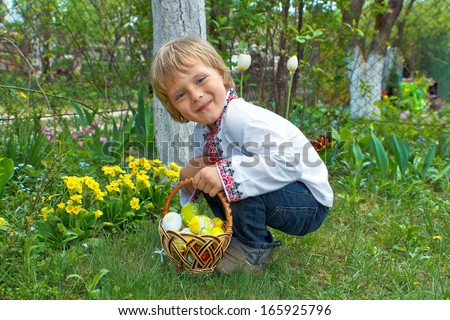 Boy with Easter Basket hunting on Easter Eggs