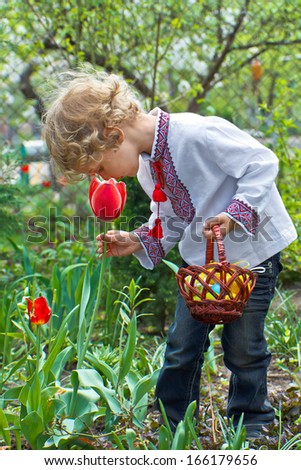 Boy with Easter Basket hunting on Easter Eggs