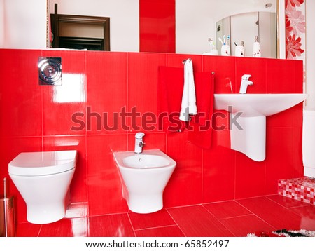 Interior of  red bathroom in modern house