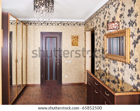 Elegance anteroom interior in warm tones with hall-stand and mirror