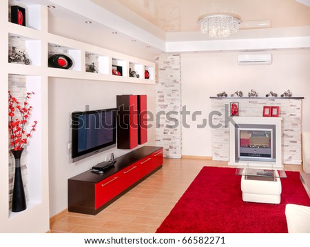 Beige and red interior of modern house with flat TV set and fair place