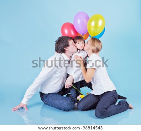 Happy family with colorful balloons