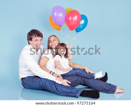 Happy family with balloons